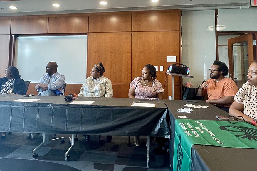 Attendees seated at a table during the Sankofa mentorship program luncheon