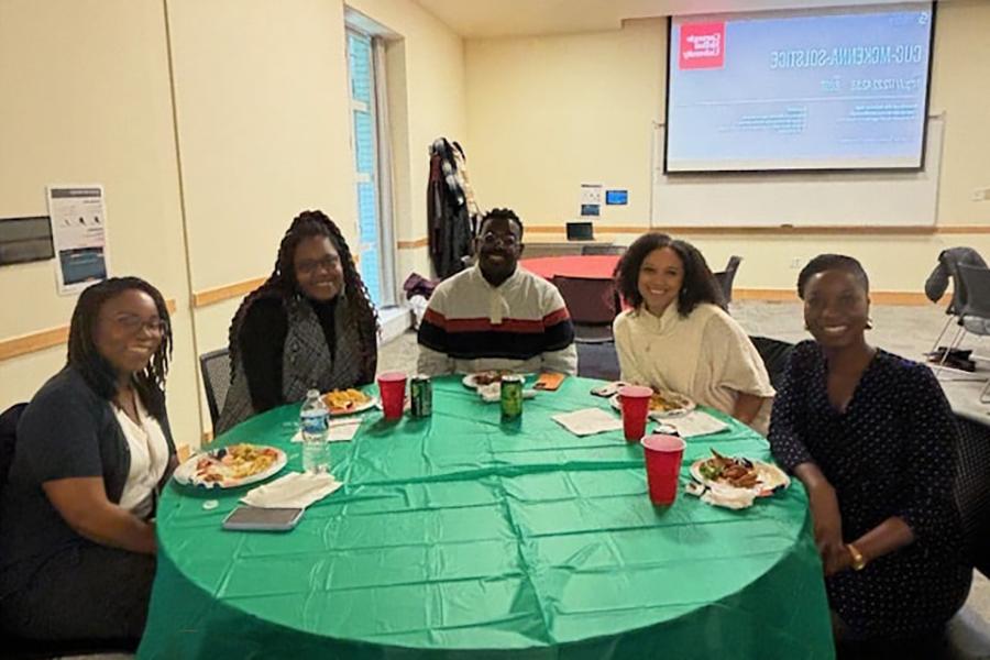 Attendees seated at banquet table