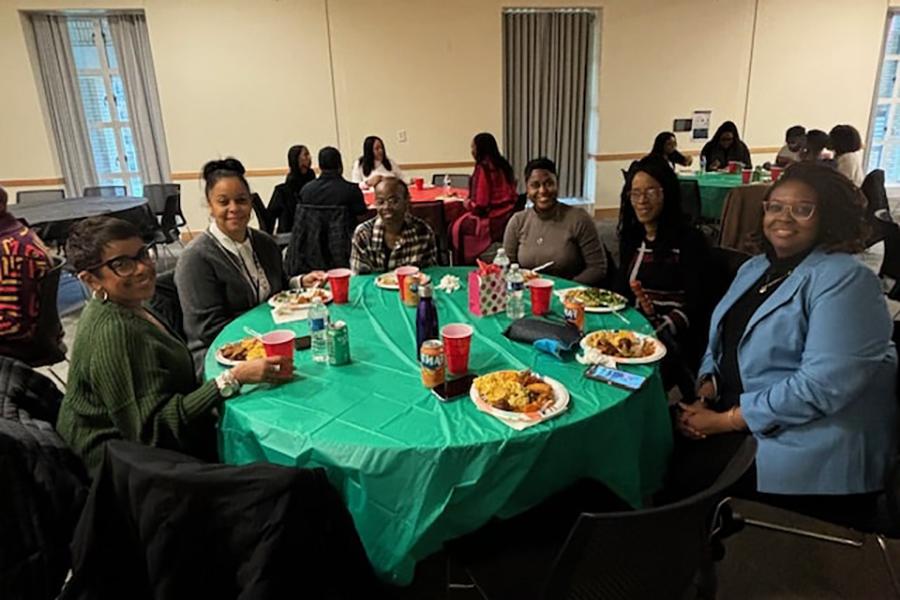 Attendees seated at banquet table